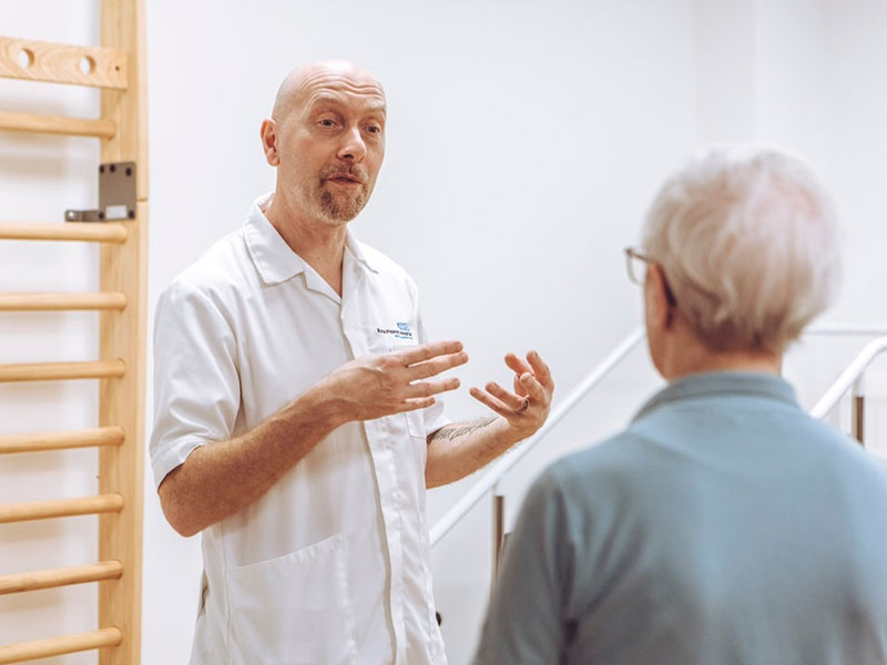 Male nurse explaining with hands