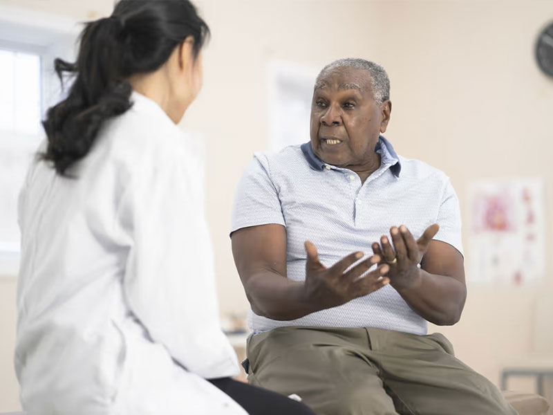 Man gesticulating to doctor
