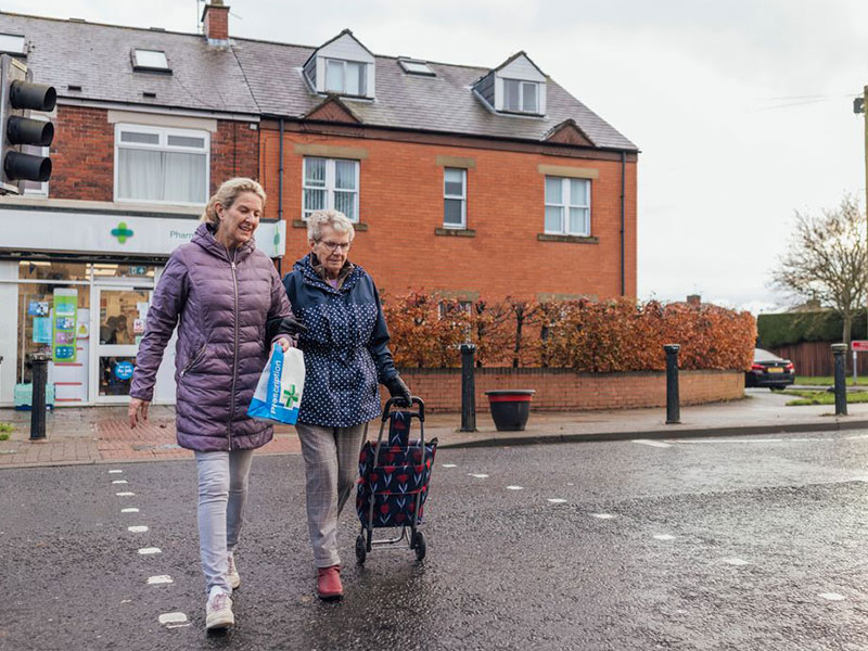 Old ladies crossign street